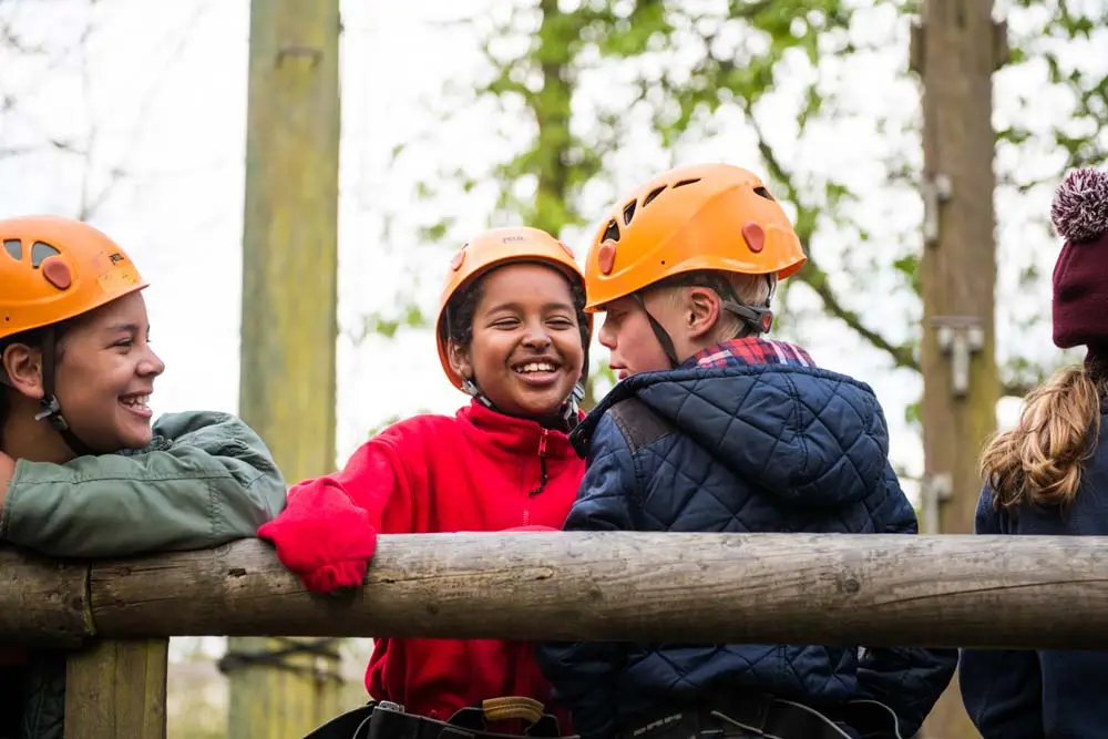 Cub Scouts in helmets chatting