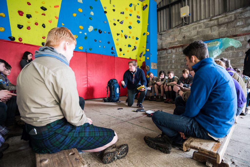 Explorers by climbing wall