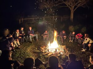 Highweek Explorers around a campfire