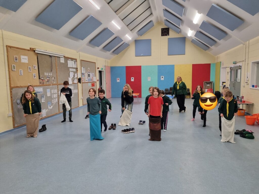 1st Chudleigh Cubs having a sack race